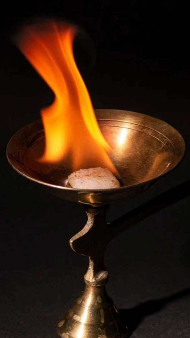 What happens by burning camphor by adding camphor to the lamp?