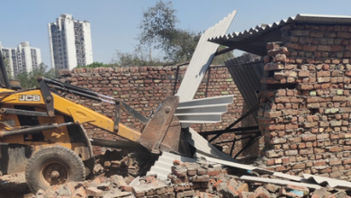 NEIDA AUTHORITY management bulldozers on illegal construction, 8 crore land evacuated