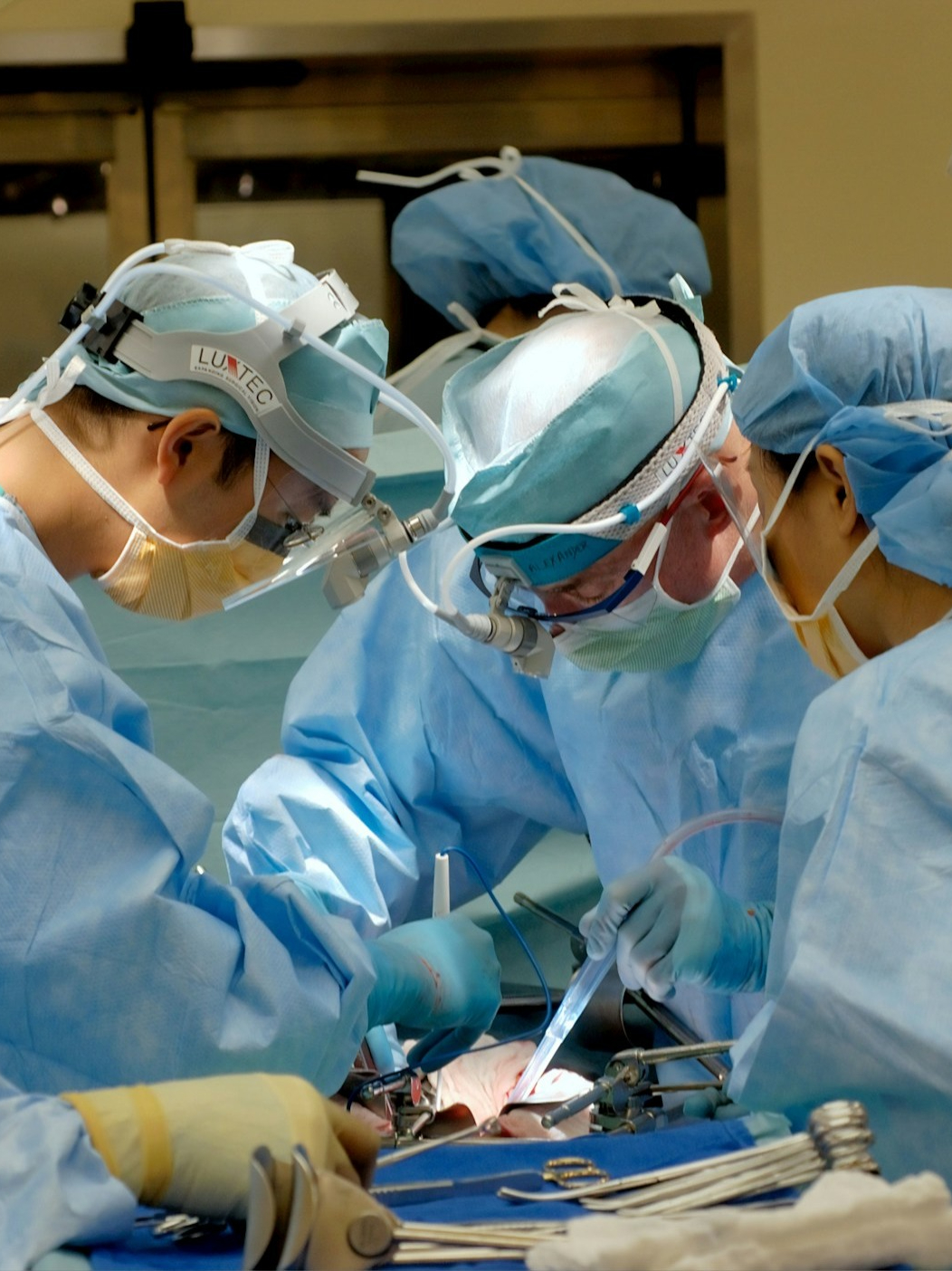 Why do doctors wear green and blue clothes?