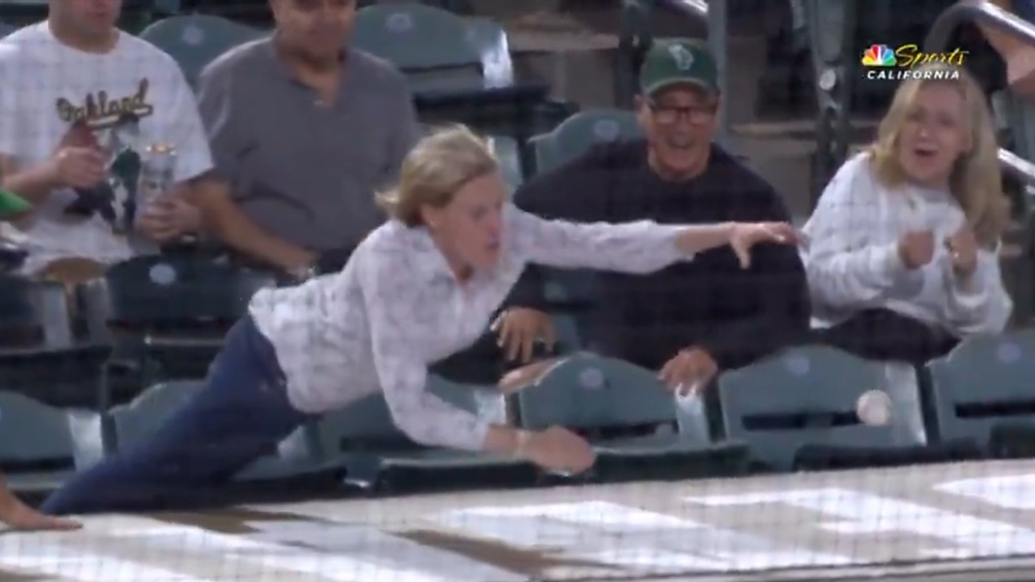 athletics-fan-dives-on-top-of-dugout-for-foul-ball