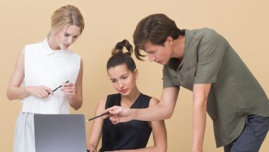 Why do people hesitate to talk to Hindi in the office?