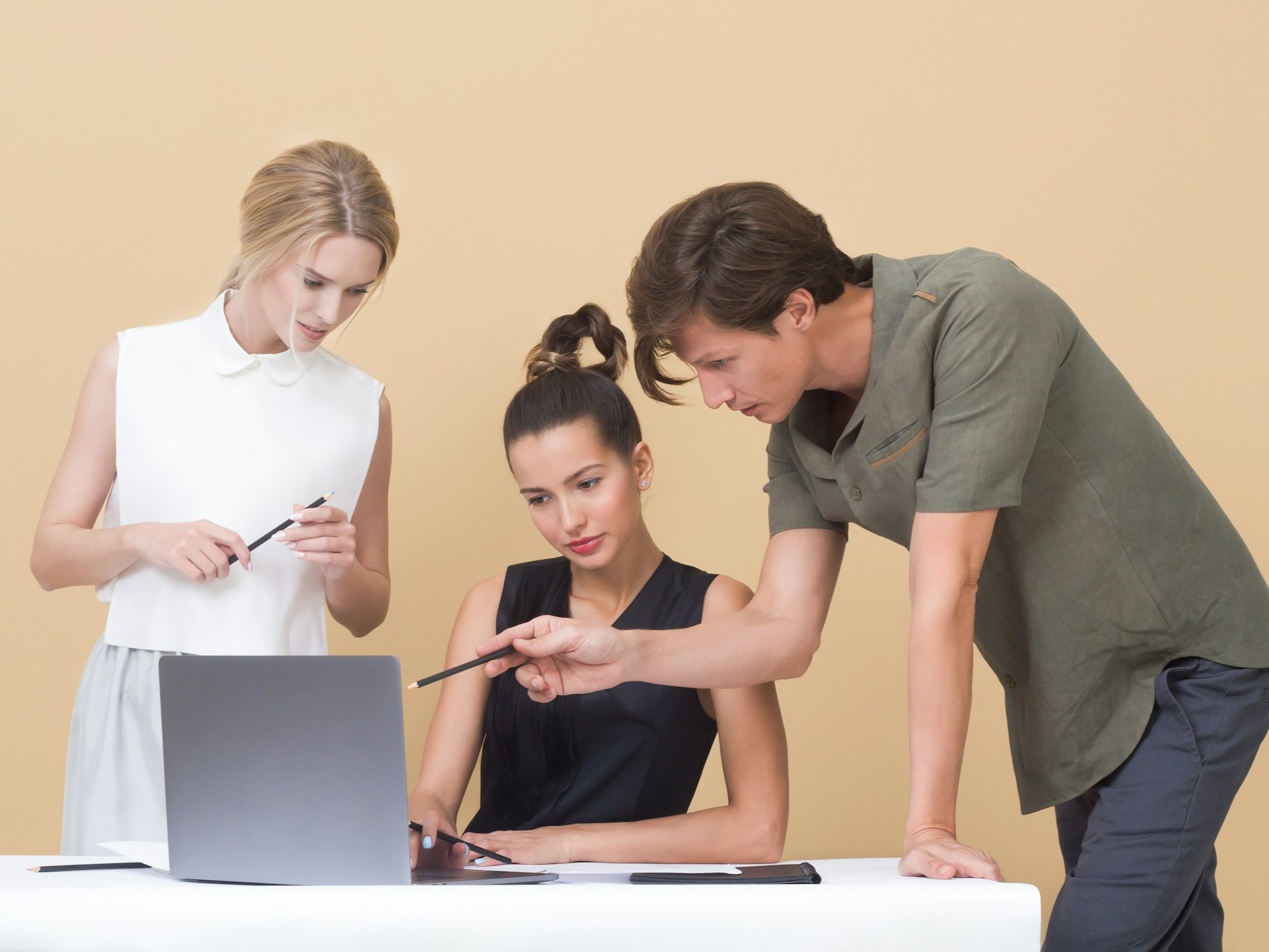 Why do people hesitate to talk to Hindi in the office?