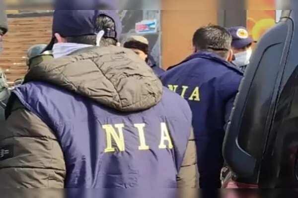 Who is the notorious terrorist Tariq Ahmed Mir? Of which the NIA attached assets, connection to Hizbul Mujahideen