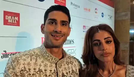 Pratek Smita Patil just keeps walking the driveway with his wife